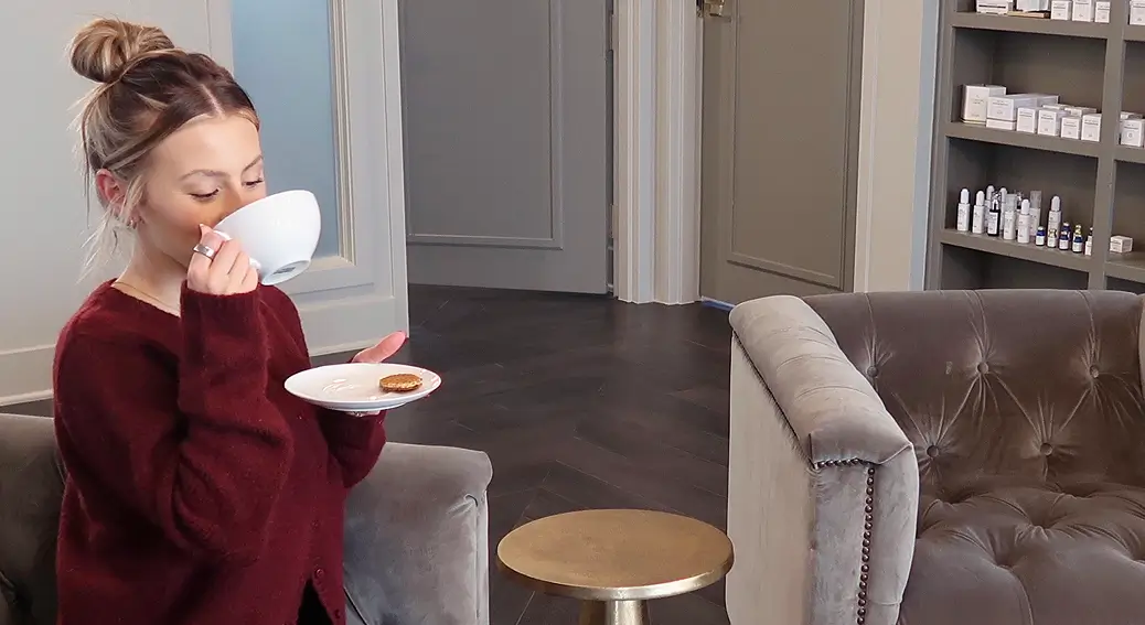 Client relaxing with a coffee in the Luxe Forté lounge.